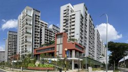 Bedok Beacon residential blocks with landscaped greenery and clear blue sky in the background