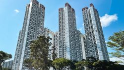 City Vue @ Henderson residential blocks with tall white buildings and surrounding trees under clear blue sky