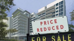 Residential apartment blocks with a "Price Reduced" and "For Sale" sign in front, surrounded by trees